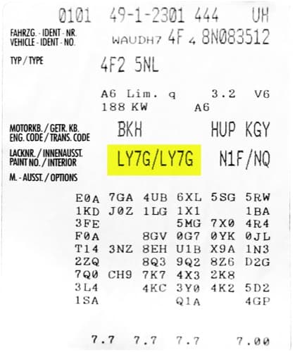 Close-up of Audi paint code label on a vehicle door jamb