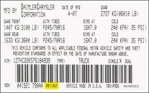 Close-up of Chrysler paint code label on a vehicle door jamb
