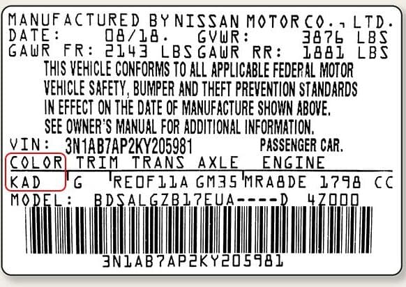 Close-up of Datsun paint code label on a vehicle door jamb