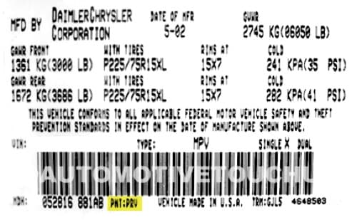 Close-up of Dodge paint code label on a vehicle door jamb