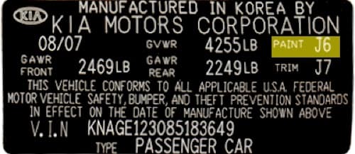 Close-up of Kia paint code label on a vehicle door jamb