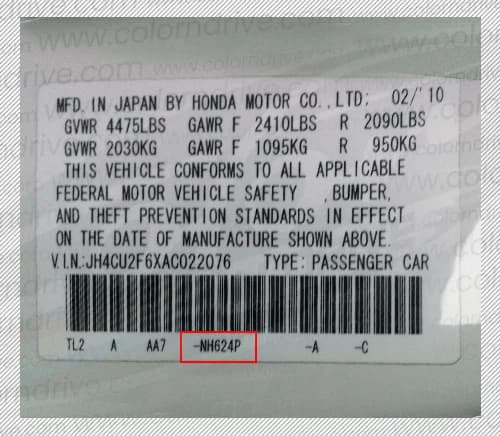 Close-up of Acura paint code label on a vehicle door jamb