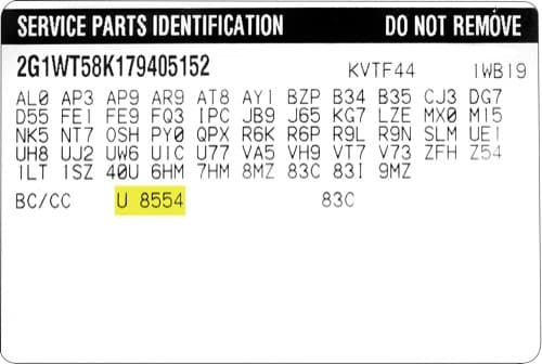Close-up of Cadillac paint code label on a vehicle door jamb