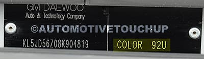 Close-up of Daewoo paint code label on a vehicle door jamb