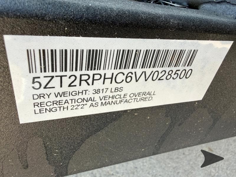 Close-up of Forest River paint code label on a vehicle door jamb