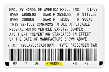 Close-up of Honda paint code label on a vehicle door jamb