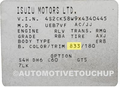 Close-up of Isuzu paint code label on a vehicle door jamb