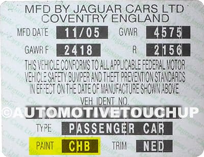 Close-up of Jaguar paint code label on a vehicle door jamb