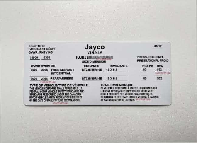 Close-up of Jayco paint code label on a vehicle door jamb