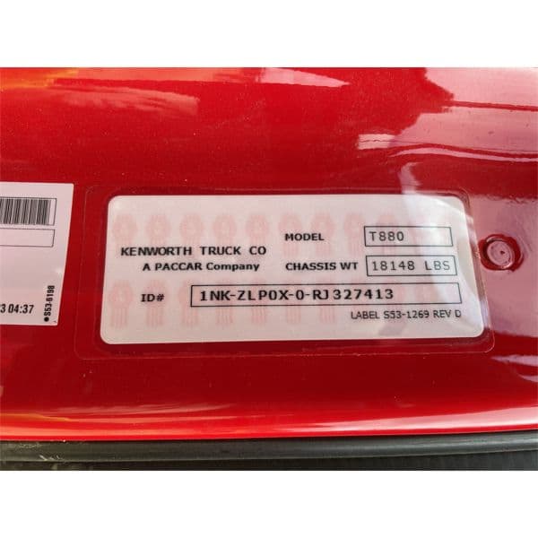 Close-up of Kenworth paint code label on a vehicle door jamb