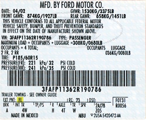 Close-up of Lincoln paint code label on a vehicle door jamb