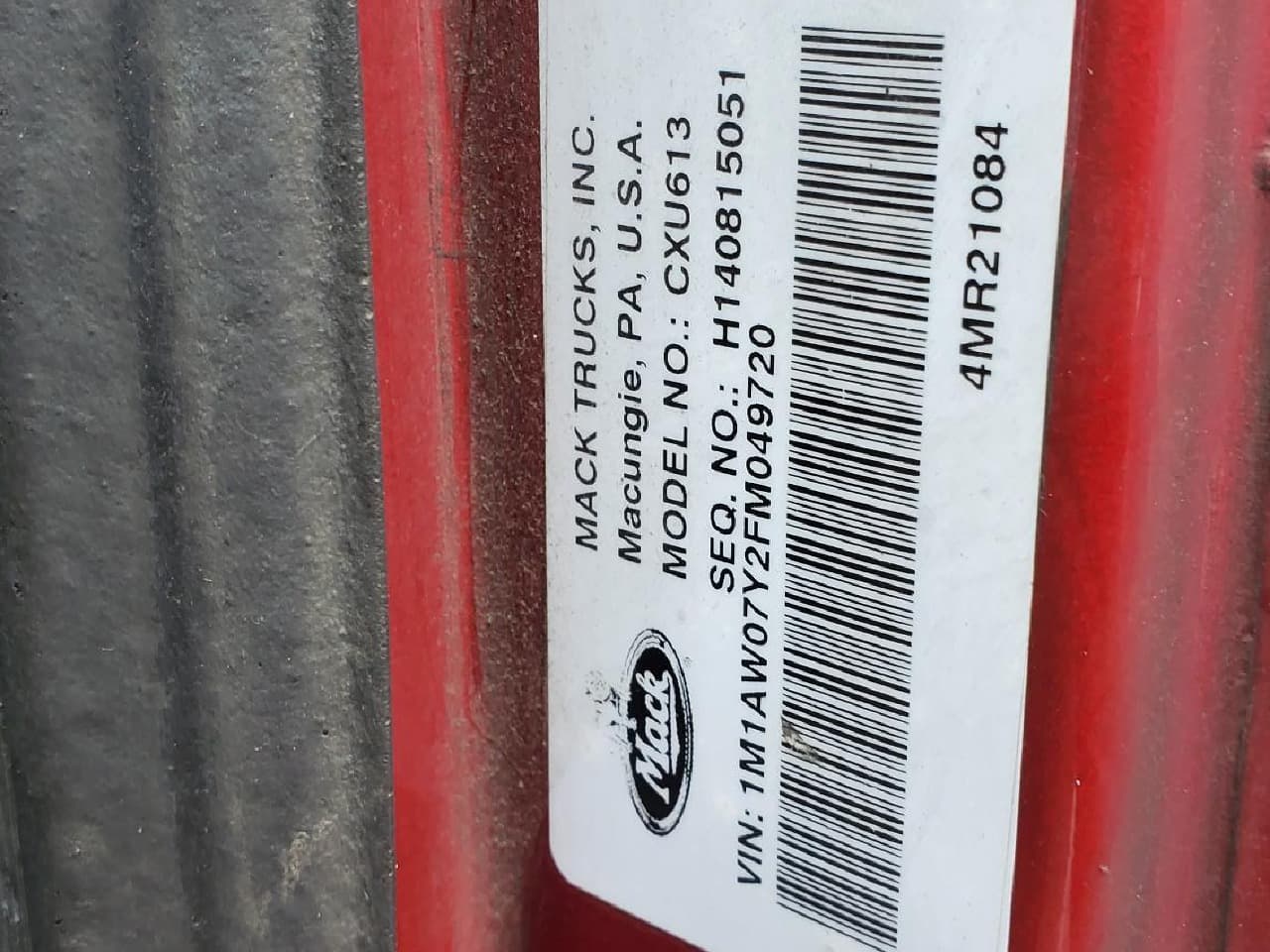 Close-up of Mack paint code label on a vehicle door jamb