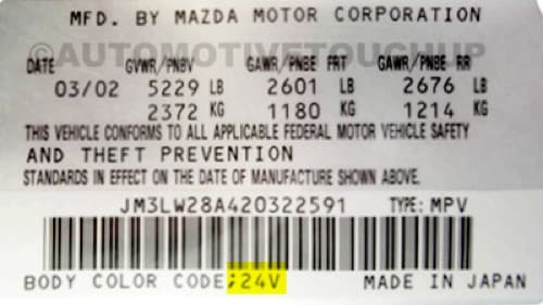 Close-up of Mazda paint code label on a vehicle door jamb