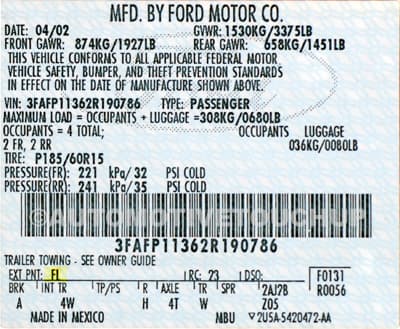Close-up of Mercury paint code label on a vehicle door jamb