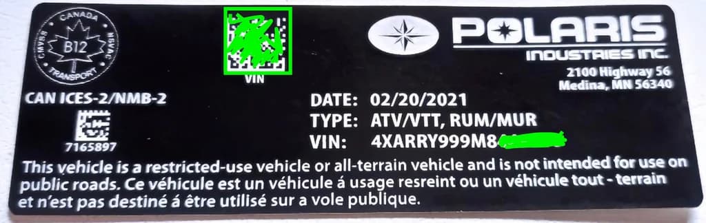 Close-up of Polaris paint code label on a vehicle door jamb